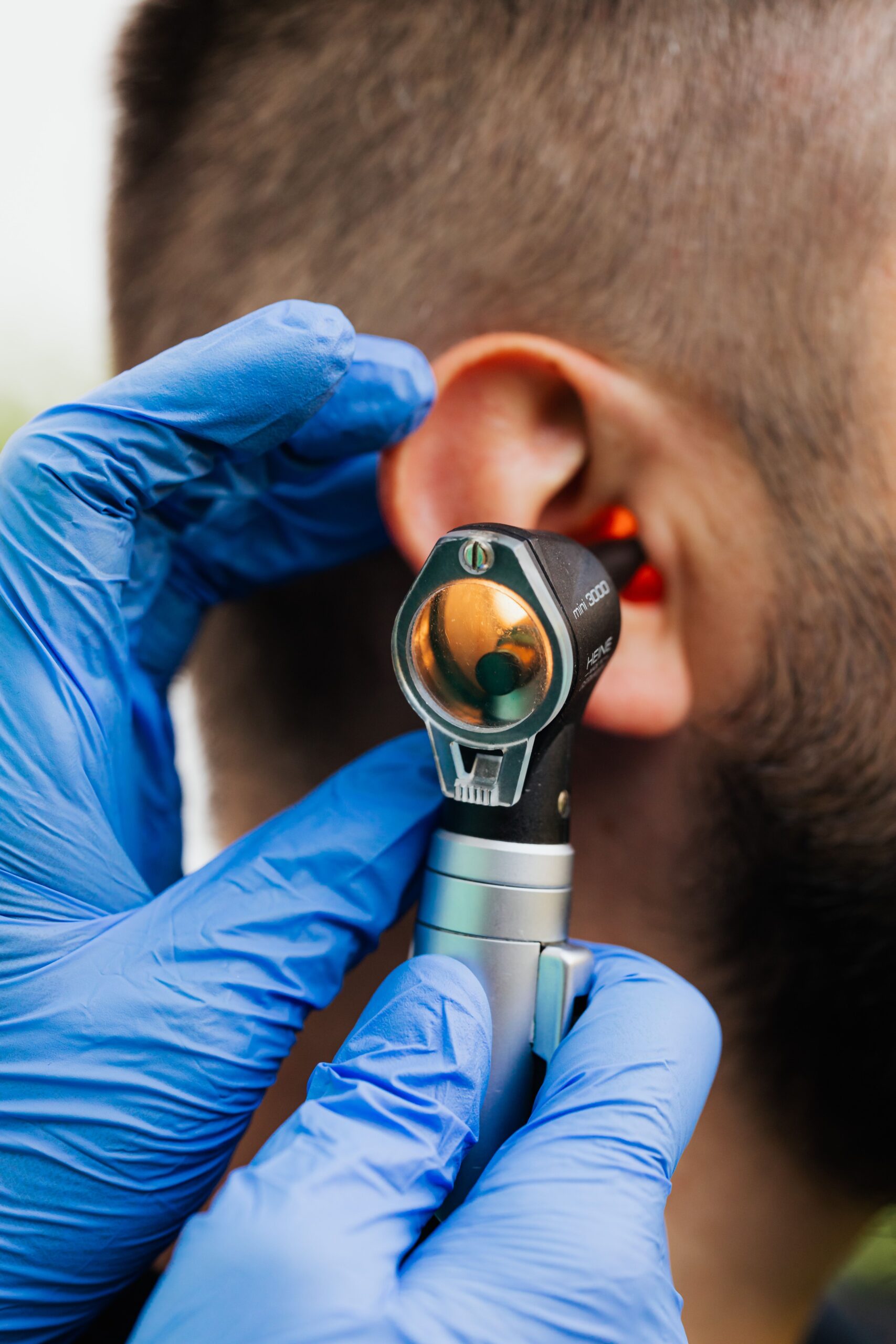Doctor performing a hearing assessment on a patient